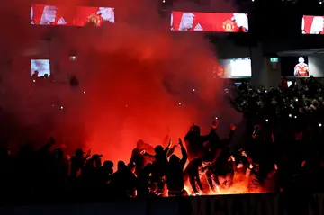 Melbourne Victory fans burned flares during their clash against Manchester United