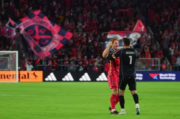 Roman Bürki and Tim Parker of St. Louis City celebrate after a Major League soccer win over Charlotte FC