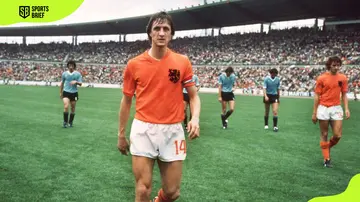 Johan Cruyff is widely considered a Dutch football hero and is seen here leaving the pitch after winning the 1974 FIFA World Cup preliminary round game against Ururguay on 15 June 1974.