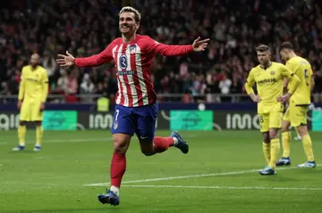 Atletico Madrid's French forward Antoine Griezmann celebrates netting his 300th career goal in the win over Villarreal