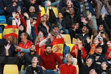 Spain fans cheer ahead of a friendly football match between Jordan and Spain, at the Hussein Youth City stadium