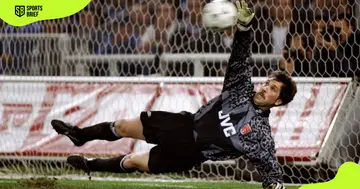 Arsenal's former goalie David Seaman dives for a ball during a match against Sampdoria 