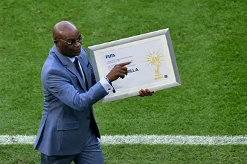 Former Cameroon player Roger Milla received an award before the match for being the oldest goalscorer in World Cup history