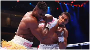 Anthony Joshua punches Francis Ngannou during the Heavyweight at the Knockout Chaos boxing card. Photo: Richard Pelham.