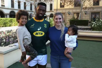 Siya Kolisi with his wife and kids