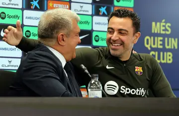 FC Barcelona president Joan Laporta (L) and coach Xavi (R) spoke on Thursday about the latter's decision to stay on