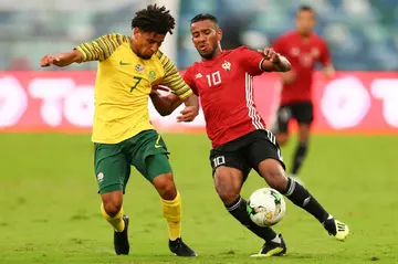 Kaizer Chiefs scorer Keagan Dolly (L) playing for South Africa against Libya in an Africa Cup of Nations qualifier.