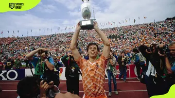 Dutch footballer Marco van Basten lifts the trophy