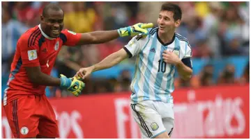 Lionel Messi and Vincent Enyeama smile during a Group F football match between Nigeria and Argentina. Photo: Pedro Ugarte.