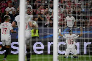 Sevilla's Moroccan forward Youssef En-Nesyri (R) celebrates scoring his team's first goal against Copenhagen