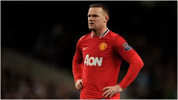 Wayne Rooney looks dejected at the end of the Barclays Premier League match between Manchester City and Manchester United at the Etihad Stadium. Photo by Michael Regan.