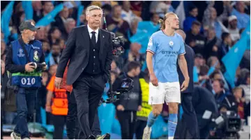 Real Madrid manager Carlo Ancelotti walks off the pitch after Real Madrid lost to Manchester City at Etihad Stadium. Photo by Richard Callis.