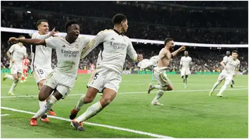 Real Madrid players celebrate a goal during their La Liga match against Almeria at Santiago Bernabeu. Photo by Guillermo Martinez.