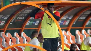André Onana looks disappointed on the bench during the Africa Cup of Nations match between Nigeria and Cameroon at Stade Felix Houphouet-Boigny. Photo by MB Media.