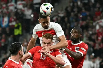 Merih Demiral (centre) was Turkey's hero with two goals against Austria