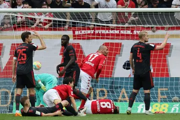 Level terms: Mainz forward Ludovic Ajorque (centre) equalises
