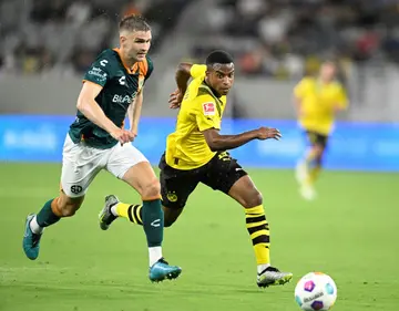 Youssoufa Moukoko (R) is Borussia Dortmund's youngest player and youngest goal-scorer