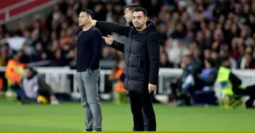 Barcelona coach, Xavi Hernandez gestures in disappointment during the La Liga match against Girona at the Lluis Companys Olympic Stadium.