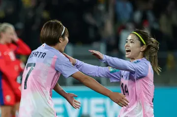 Hinata Miyazawa (L) celebrates scoring Japan's third goal against Norway with Yui Hasegawa (R) at the Women's World Cup