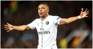 Kylian Mbappe celebrates after scoring his side's second goal during the UEFA Champions League Round of 16 First Leg match between Man United and Paris Saint-Germain. Photo by Michael Regan.