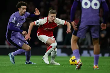 Competing with the best: Arsenal defender Oleksandr Zinchenko (C) pictured in action against Premier League title rivals Liverpool