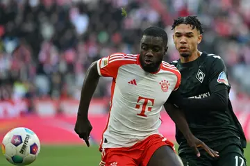 Bayern Munich defender Dayot Upamecano (L) will miss "weeks not days" with a hamstring strain, said manager Thomas Tuchel