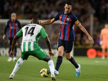 Barcelona midfielder Sergio Busquets (R) is calling time on his storied career at the club