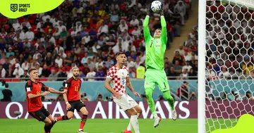 Thibaut Courtois saves a shot during the 2022 FIFA World Cup Group F match between Croatia and Belgium.