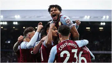 Tyrone Mings celebrates during the Premier League match between Aston Villa and Liverpool at Villa Park. Photo by Ryan Pierse.