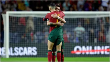 Cristiano Ronaldo and Bruno Fernandes celebrating during the EURO Qualifier match between Portugal and Slovakia at the Estadio Do Dragao. Photo by David S.Bustamante.