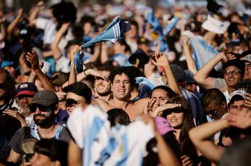 Thousands of fans in a square in Buenos Aires celebrate as Argentina reach the World Cup final
