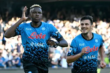 Victor Osimhen (L) reacts after one of his three goals for Napoli against Sassuolo.