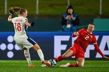 Norway's Frida Maanum (L) and Switzerland's Julia Stierli fight for the ball during their Women's World Cup clash on Tuesday