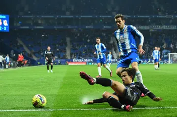 Real Sociedad forward Takefusa Kubo vies with Espanyol defender Brian Olivan