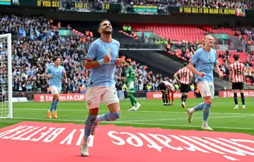 Manchester City's Riyad Mahrez celebrates scoring against Sheffield United