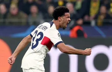 Warren Zaire-Emery celebrates the goal that booked PSG's place in the Champions League knockouts