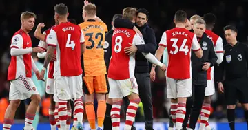 Mikel Arteta, Manager of Arsenal embraces Martin Odegaard of Arsenal following victory in the Premier League match between Arsenal and Leicester City at Emirates Stadium on March 13, 2022 in London, England. (Photo by Catherine Ivill/Getty Images)