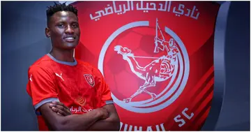 Olunga poses for a photo after sealing his move to Al Duhail. 
 Photo: Twitter/Michael Olunga.
