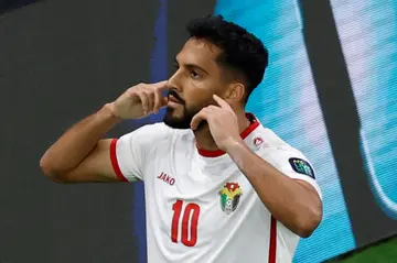 Mousa Al-Tamari celebrates after scoring against South Korea