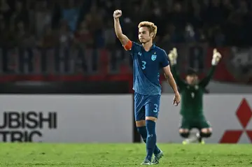 Thailand's Theerathon Bunmathan celebrates after winning the AFF Cup in Bangkok