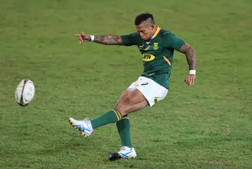 Elton Jantjies kicks a conversion during the Rugby Union international matches