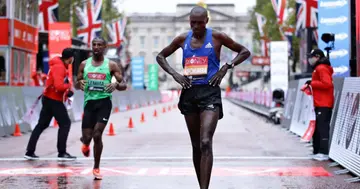 Second place Vincent Kipchumba of Kenya reacts as he crosses the finish line in the Elite Men’s race during the 2020 Virgin Money London Marathon around St. James's Park on October 04, 2020 in London (Photo by Richard Heathcote/Getty Images)