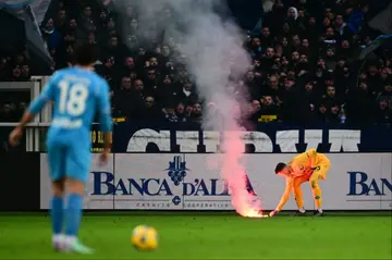 Napoli fans showed their displeasure at Torino by launching a barrage of flares onto the pitch