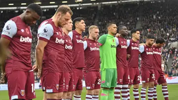 West Ham United players observing the minutes silence for service men and women who have lost their lives in conflicts across the world