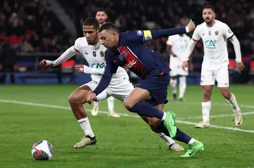 Kylian Mbappe is watched closely by Jean-Clair Todibo during Paris Saint-Germain's French Cup quarter-final win against Nice