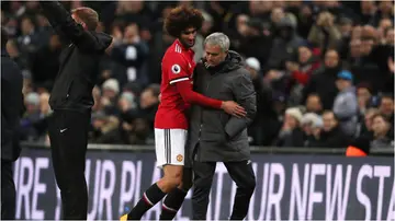 Marouane Fellaini and Jose Mourinho during the Premier League match between Tottenham Hotspur and Manchester United at Wembley Stadium in 2018. Photo by Matthew Ashton.