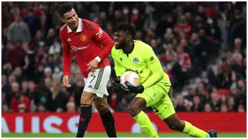 Francis Uzoho and Cristiano Ronaldo during the UEFA Europa League group E match between Manchester United and Omonia Nikosia at Old Trafford. Photo: Clive Brunskill.