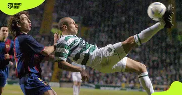 Celtic's Henrik Larsson (r) attempts an overhead kick.