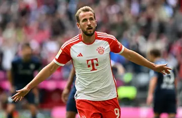 Record-breaker: Bayern Munich's Harry Kane celebrates scoring a hat-trick in the 7-0 win over Bochum on Saturday