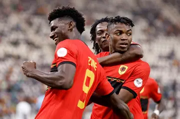 Gelson Dala (R) celebrates his second goal for Angola in an Africa Cup of Nations win over Mauritania.